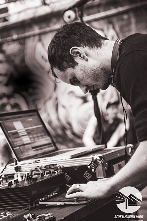 Eckul at a production setup with mixer and laptop